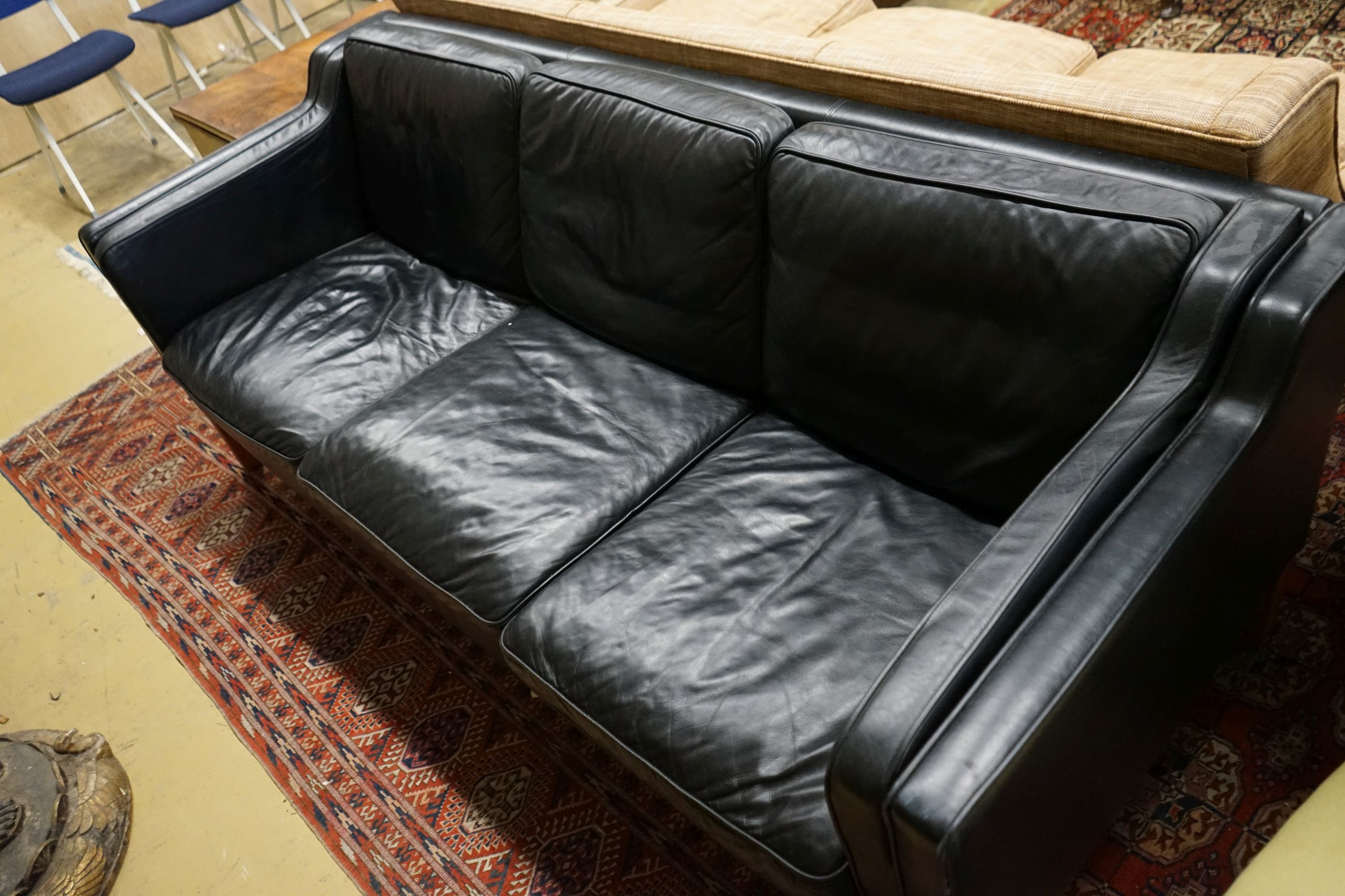 A mid century Danish black leather three seater sofa in the style of Borge Mogensen, length 201cm, depth 80cm, height 76cm